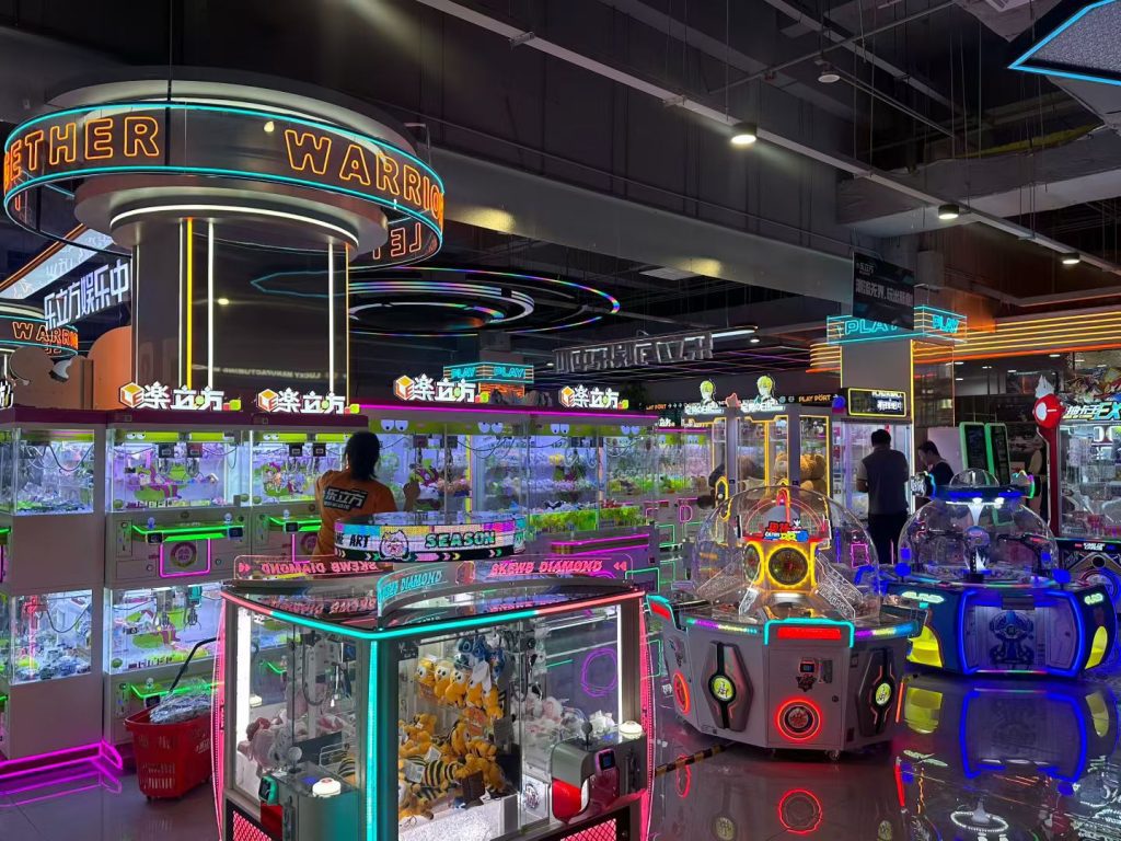 Panoramic view of comprehensive entertainment zone with multiple game machines - GO2AMUSE