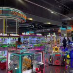 Panoramic view of comprehensive entertainment zone with multiple game machines - GO2AMUSE