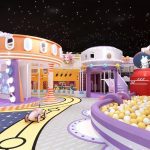 Space racing track with orange station and toy cars