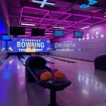 Professional bowling alley with neon lighting and tournament setup - GO2AMUSE